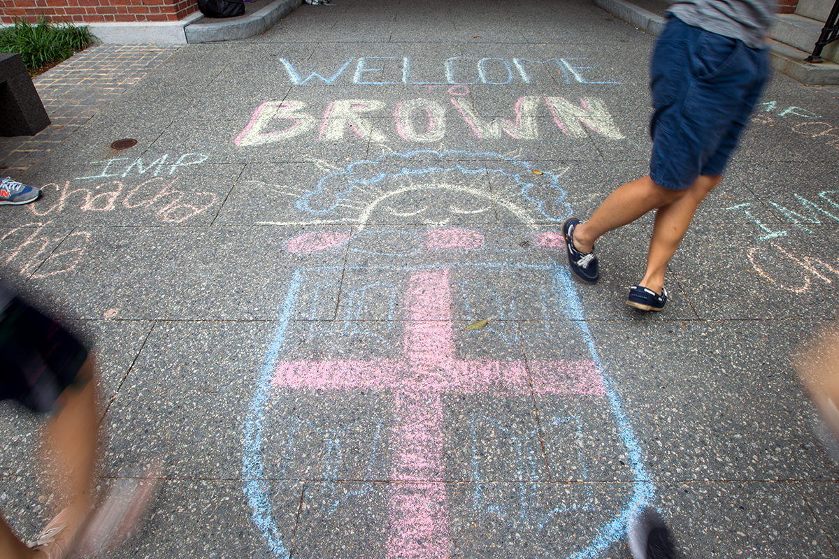 Sidewalk chalk drawing reading "welcome to brown"
